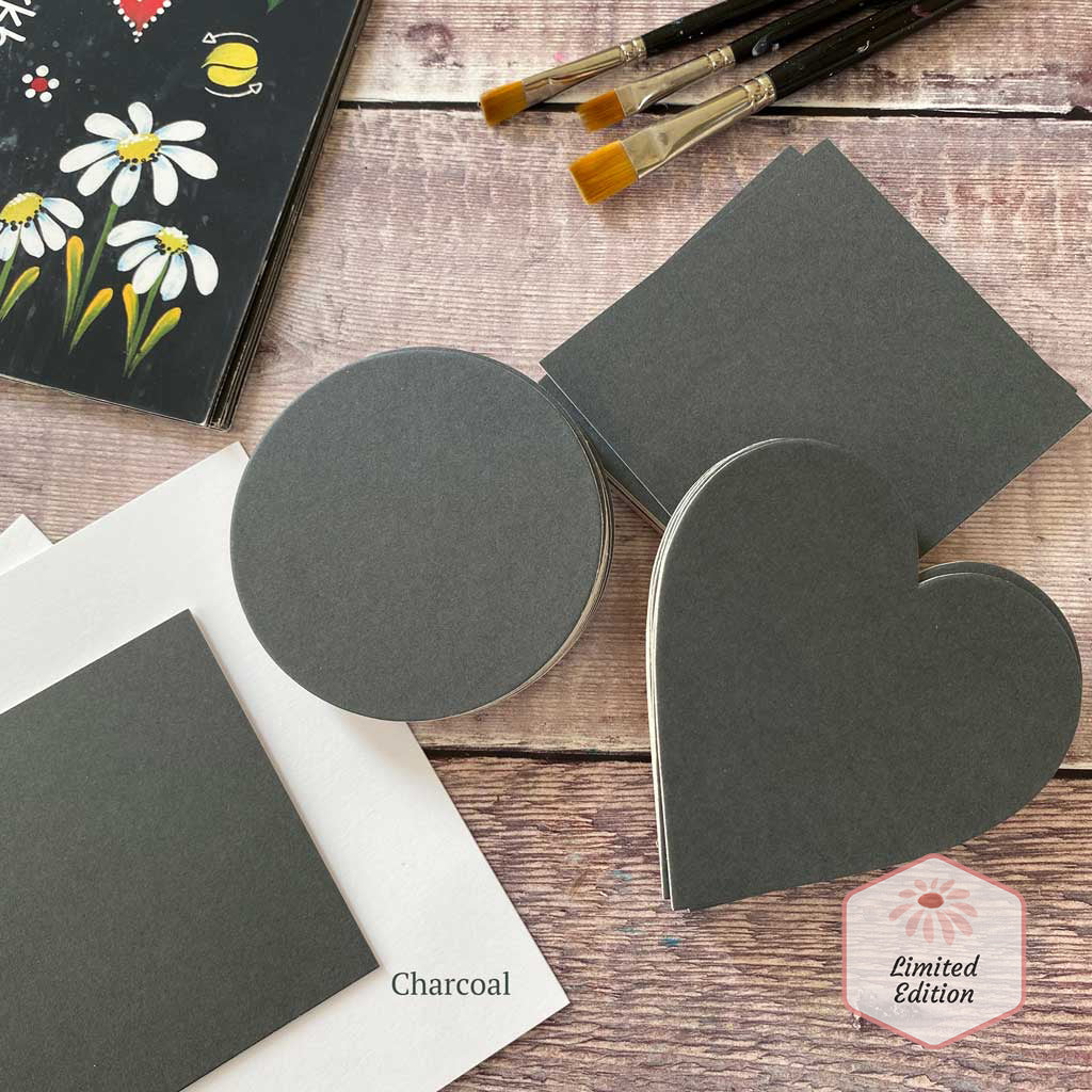 30 charcoal colour mounts in a variety of shapes - circles, hearts and squares. 